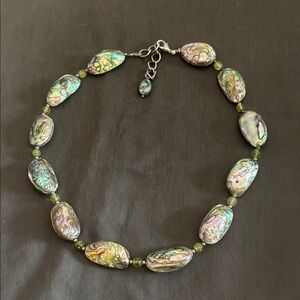 Shell and stone necklace with silver detail.